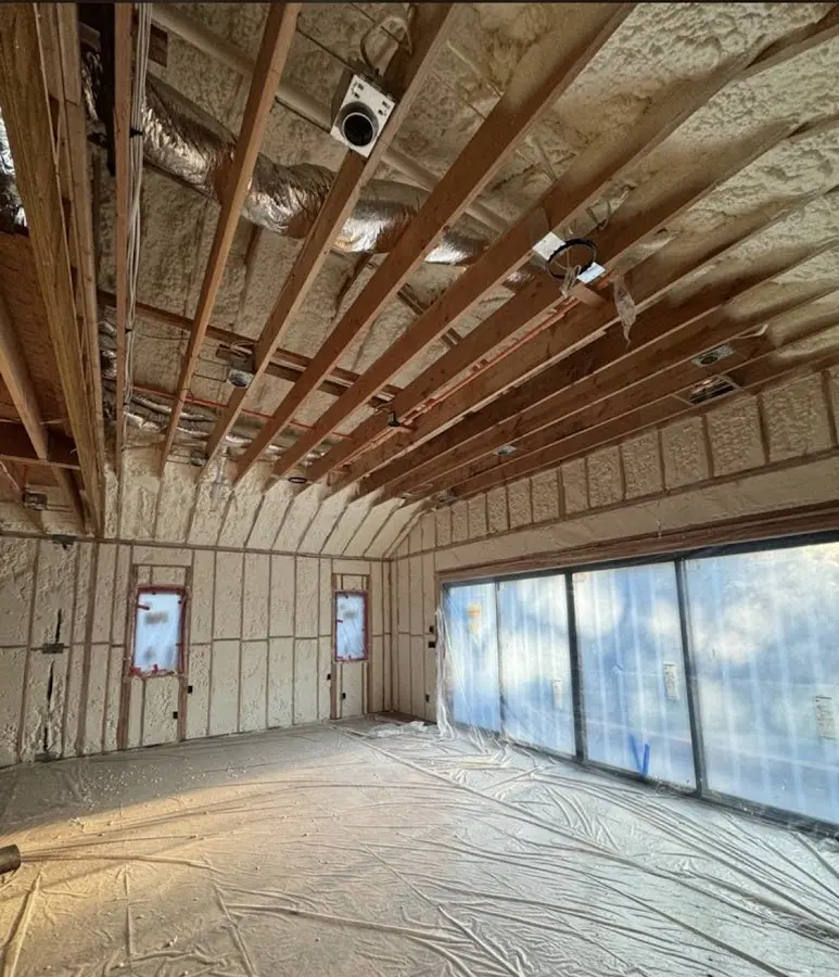 Interior walls and ceiling insulated with spray foam during new construction in Okeechobee